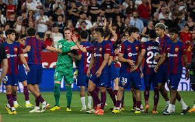 Barcelona's Robert Lewandowski scores one of his two goals against Sevilla at Olimpic Lluis Companys Stadium